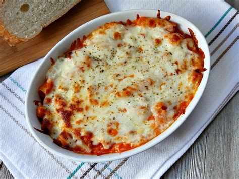 Add a generous 1/3 cup of oil to add the tomato sauce, rigatoni, and the reserved pasta water. Easy Two-Cheese Baked Rigatoni Recipe