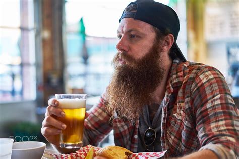 bearded hipster drinking a craft beer at restaurant or pub by Joshua Resnick on 500px | Hipster ...