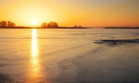 Winter Landscape With Frozen Lake And Sunset Fiery Sky Stock Image