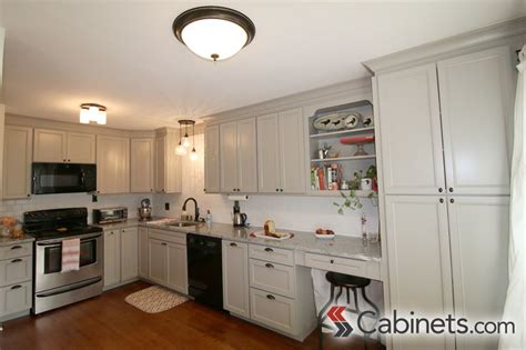 The chunky beams and rustic floating shelves add great character to jackie's kitchen. A soft gray painted finish...Deerfield Belleair Maple Willow Gray cabinets | Light grey kitchens ...