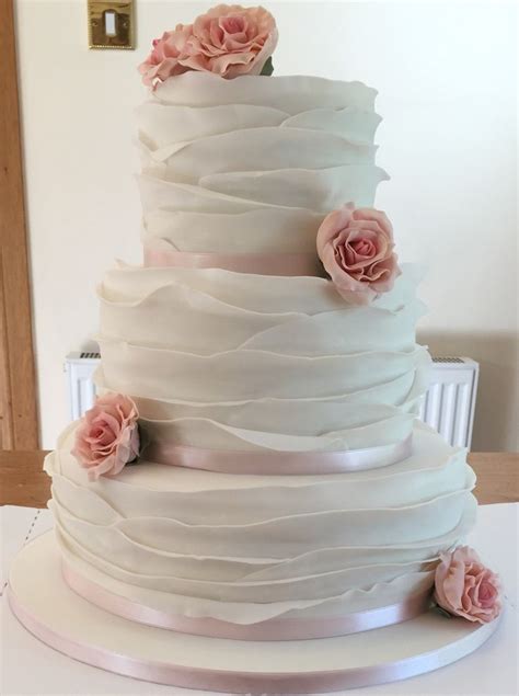 Three Tier Fondant Ruffle Cake With Dusky Pink Roses And Baby Pink Ribbon
