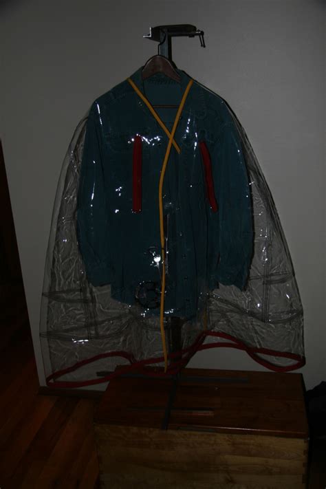 Clear Plastic Rain Cape With Hand Crafted Stainless Steel Sculpture