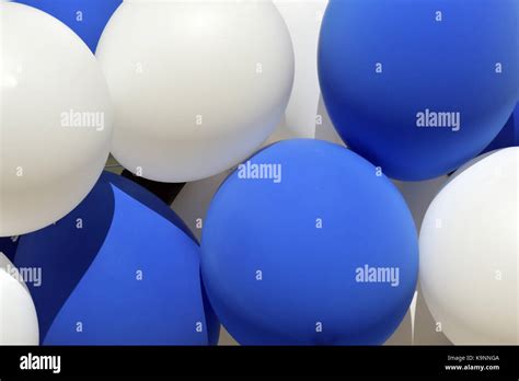 A Bunch Of Blue And White Balloons Closely Bunched Or Packed Together