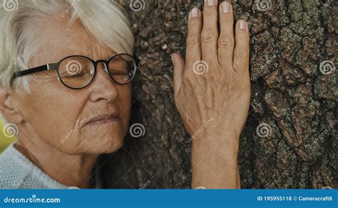 Portrait Of Senior Gray Haired Woman Hugging The Tree Stock Footage Video Of Hair Embracing