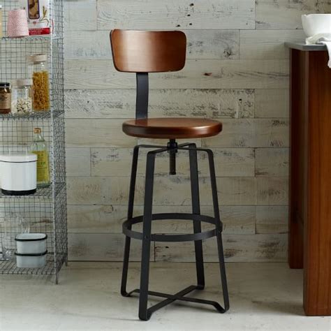 This kitchen island and stools are made of both solid and composite wood. Adjustable Rustic Industrial Stool - With Back | west elm