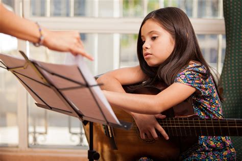 The Challenges and Benefits of Guitar Lessons for Children