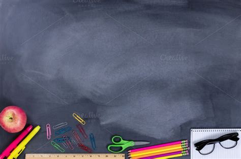 An Apple Ruler Pencils And Other School Supplies On A Chalkboard