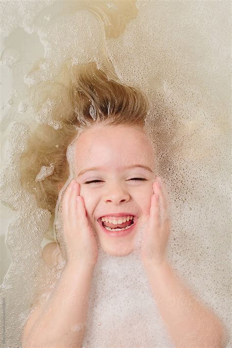 Girl Washing Her Hair In Bubble Bath By Stocksy Contributor Brian Powell Stocksy