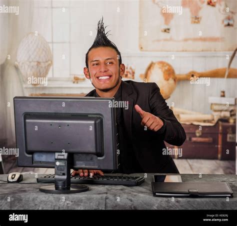 Close Up Of Smiling Office Punk Worker Wearing A Suit With A Crest