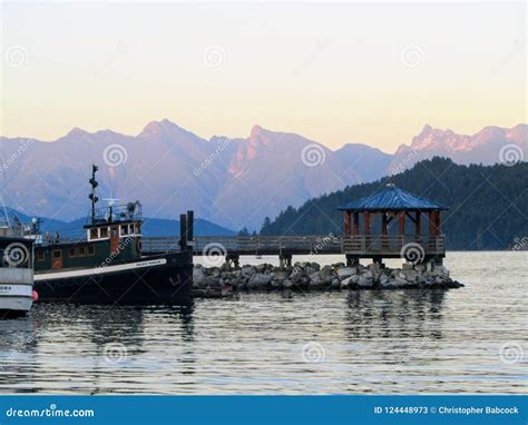 Boats Docked As The Sun Goes Down In Gibsons British Columbia