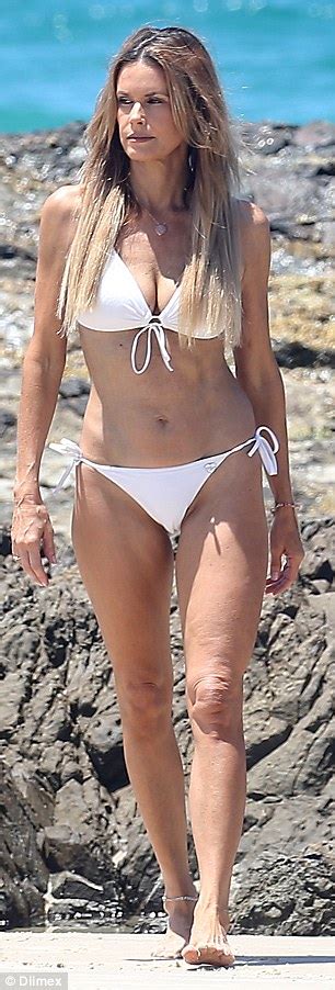 Neighbours Emma Harrison Turns Heads In White Bikini On The Beach Daily Mail Online