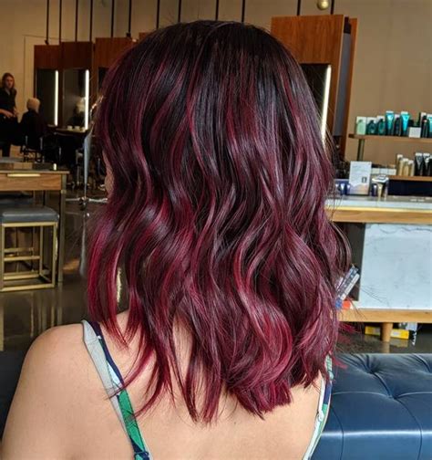 In this example, the middle layers of hair are accented creating a sandwich effect with red in the center. 10 Black Hairstyles with Red Highlights Trending Right Now