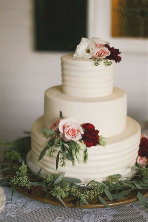 Simple Textured Ivory Three Tier Wedding Cake With Dusty Pink And