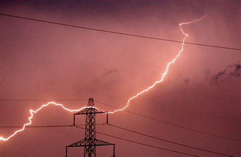 Lightning Hitting An Electricity Pylon Photograph By Peter Lawson