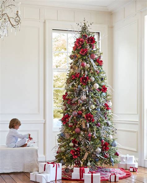 This tree is trimmed with pine cones and. 12 Beautiful Christmas Trees | Slim christmas tree, Beautiful christmas trees, Slim artificial ...