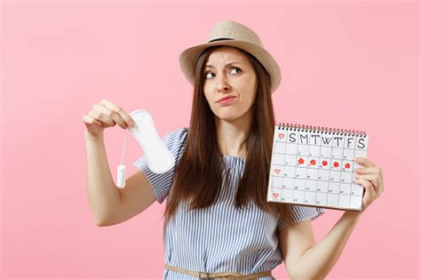 Woman In Blue Dress Hat Holding Sanitary Napkin Tampon Female Periods