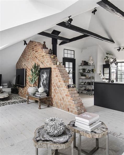 This Scandinavian Loft Has An Exposed Brick Wall Partly Dividing The