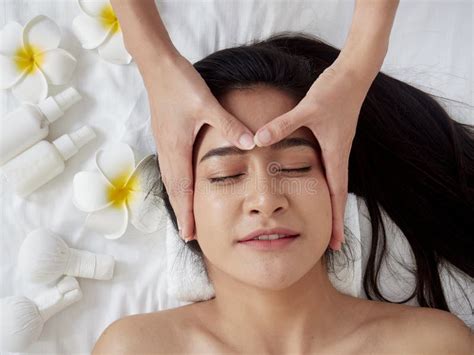 Beautiful Woman Receiving Facial Massage In Spa Stock Photo Image Of Ayurvedic Cosmetic