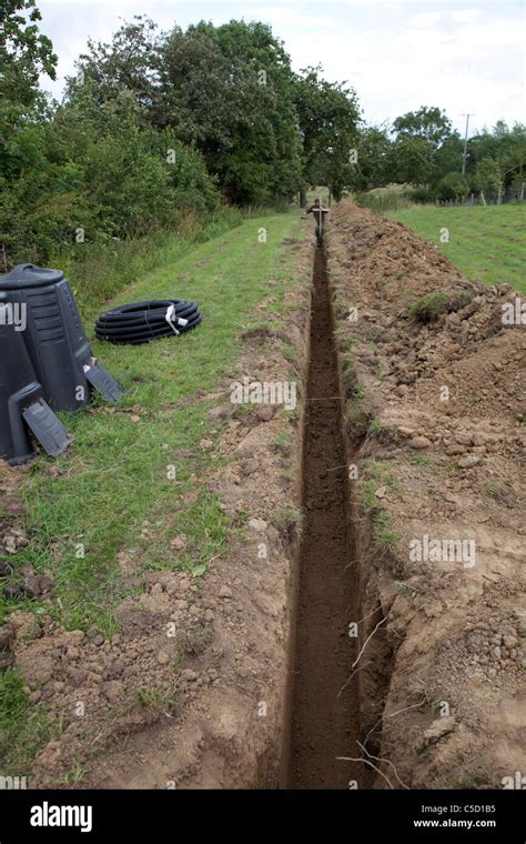 Trench Dug Out In Field To Carry Electric Cable Ducting Cotswolds Uk