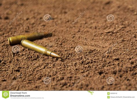 Two Bullets Machine Gun Bullets On Soil Stock Photo Image Of