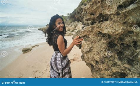 Indonesian Girl Posing On A Beautiful And Rocky Beach In Bali Idonezia Stock Image Image Of