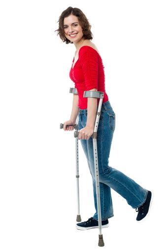 Young Woman Walking With Crutches Stock Photo Download Image Now