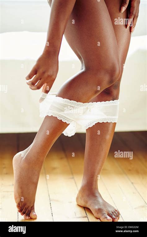 Girl Removing Her Underwear Stock Photo Alamy