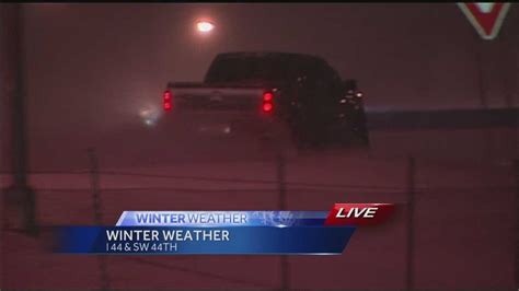 snow starting to pile up in okc causing slick roads