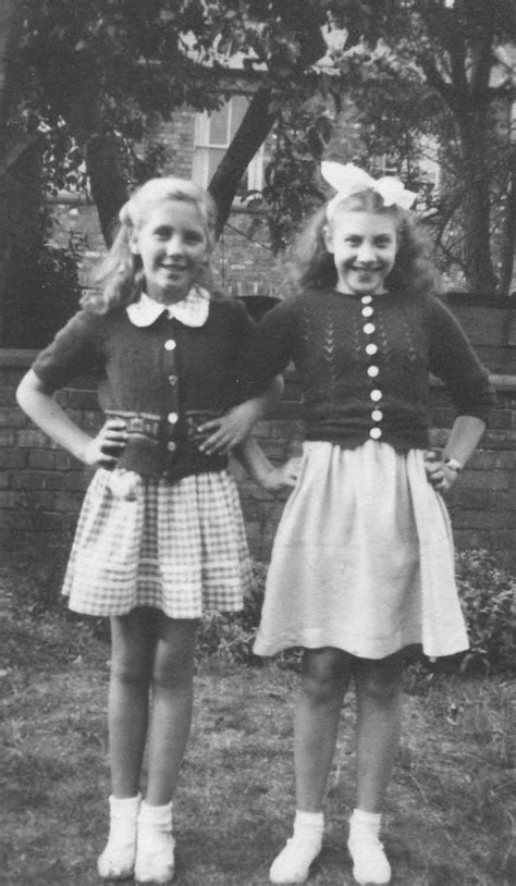 Two Girls Posing In A Garden Living Archive