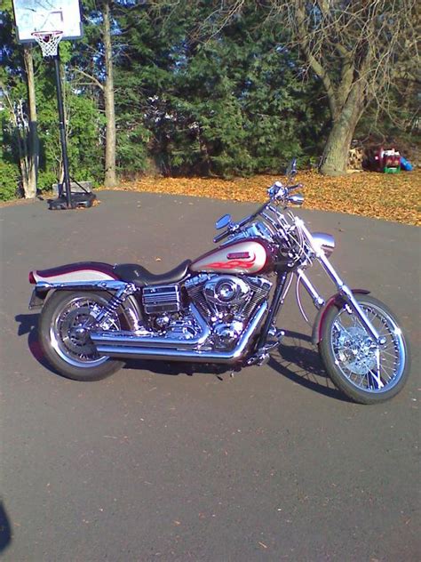Hard leather saddle bags with removable and lockable brackets that attach to the quick detach posts. 2007 Dyna Wide Glide - Harley Davidson Forums