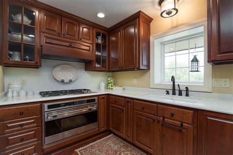 Burgundy cabinets in a contemporary kitchen. Cabinet Reface - NuWood Cabinets
