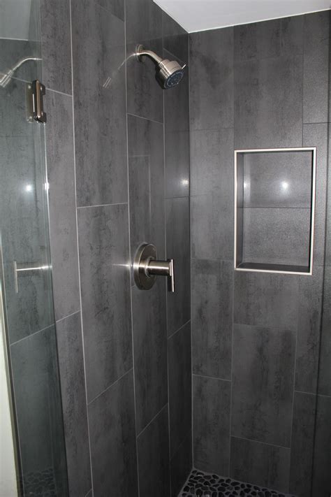 If you want to use tiles for your bathroom remodeling and the room itself is not so big, you can consider 12×24 tiles the best for decorating walls. Niche w/out bullnose Gray 12 x 24 shower tile with Danze ...