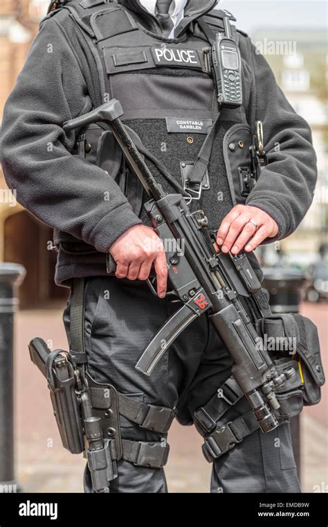 An Authorised Firearms Officer Or Afo Of The British Police Holding A