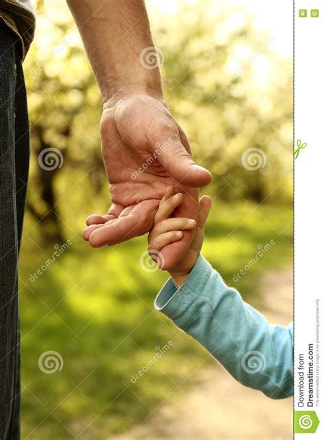 Parent Holds The Hand Of A Small Child Stock Image Image Of Parent
