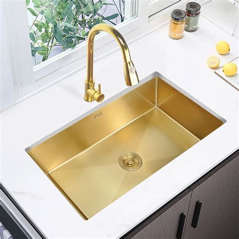A Kitchen Sink That Is Gold In Color