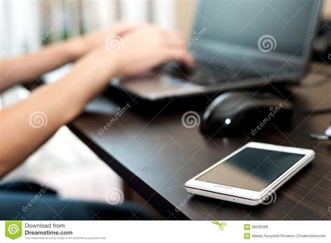 Browse through even more hd photos and videos: Cell Phone (smartphone) On A Table And Woman Working On ...