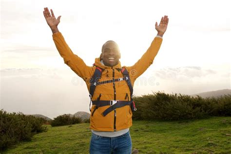 happy african american backpacker standing outdoors with hands raised stock image image of