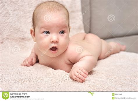 Happy Baby Lying On His Stomach Stock Photo Image Of Sheet Smile