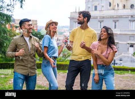 Group Of Multiethnic Friends Dancing In A Park In The City At A