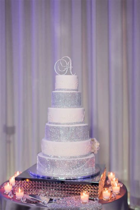 The wedding cake is often the focal point of a reception. Trisha & Onrique: Orlando, FL | Bling wedding cakes, Southern wedding inspiration, Wedding cakes