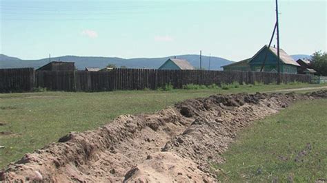 Russian Authorities Dig Trench Around Remote Siberian Village To