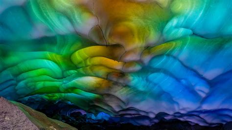 Photographer Discovers A Strange Rainbow Inside These Ice Caves The