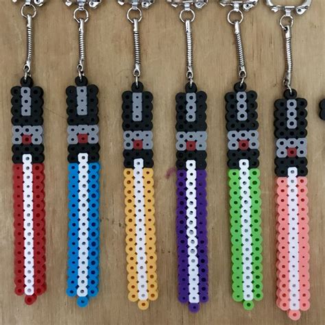 See more ideas about perler bead patterns, perler, patterned sheets. Star Wars - Lightsabers, Perler Bead Keychains | Mini hama ...