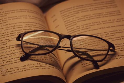 Closeup Of A Book With Glasses On It Stock Image Image Of Read