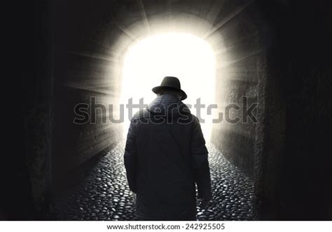 Man Walking Into Light Stock Photo Edit Now 242925505