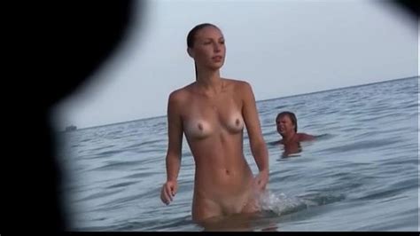 Watch A Naked Chick At The Beach Tan Her Hot Body