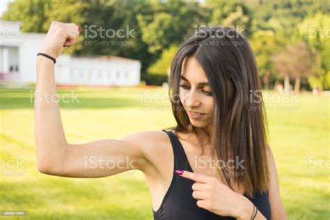 Fitness Girl Showing Her Well Trained Biceps Stock Photo Download