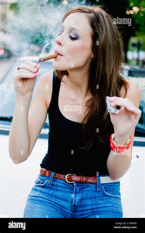 Woman Lighting A Cigar Stock Photo Alamy
