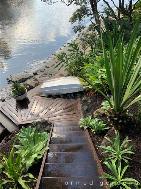 Timber stairs to the waters edge | Garden landscape design, Landscape