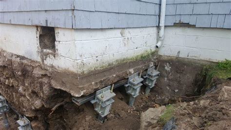 Foundation Repair Sinking Foundation Supported With Helical Piers In